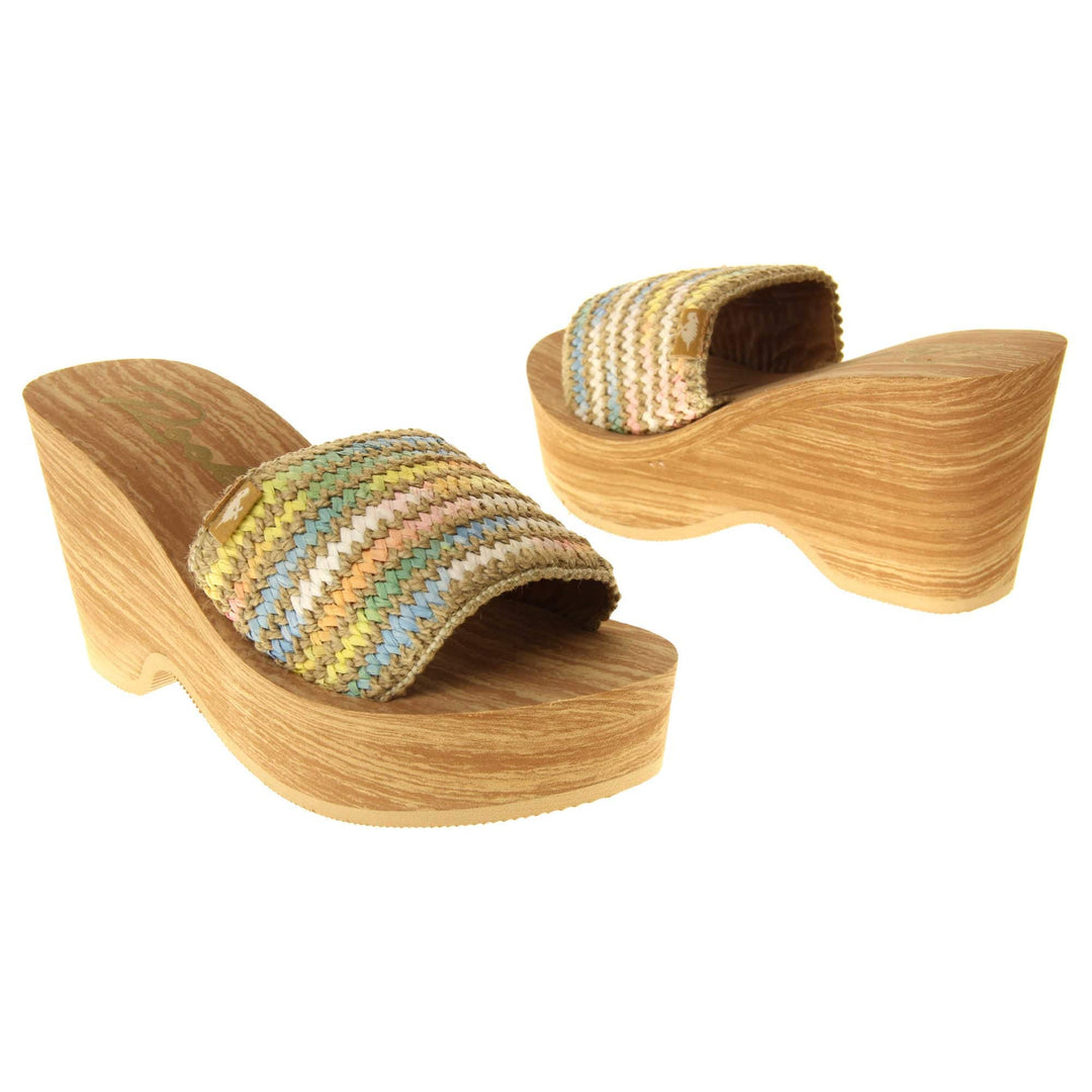 Womens Rocket Dog Wedge Sandals - Light brown wood-effect foam wedge heels with slider / mary jane strap over in a pastel rainbow zig zag design with a hessian weave in-between rows. Both feet facing different directions.