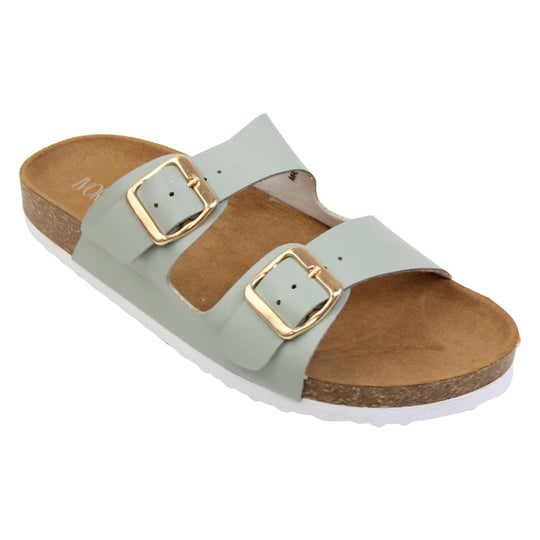 Womens sage sandals. Womens dual strap slip on sandals. With a sage green synthetic leather upper with a gold buckle on each strap. Brown faux suede insole with a moulded footbed. Cork effect outsole with white base with grip to the bottom. Right foot at an angle.