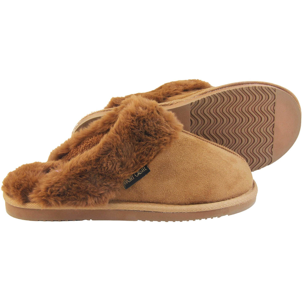 Womens slip on slippers. Mule style slippers with brown faux suede uppers. Brown faux fur lining and collar. Firm brown outsole with grip on the bottom. Both feet from a side profile with the left foot on its side behind the the right foot to show the sole.