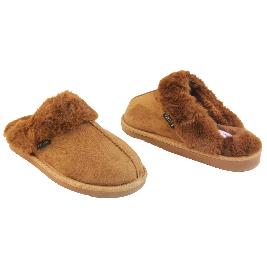 Womens slip on slippers. Mule style slippers with brown faux suede uppers. Brown faux fur lining and collar. Firm brown outsole with grip on the bottom. Both feet at an angle, facing top to tail.