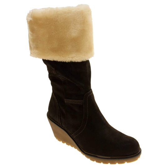 Womens wedge heel boots - brown suede effect upper with chunky wedge heel, full inner zip, faux fur cuff and brown stitching. Right foot at angle.