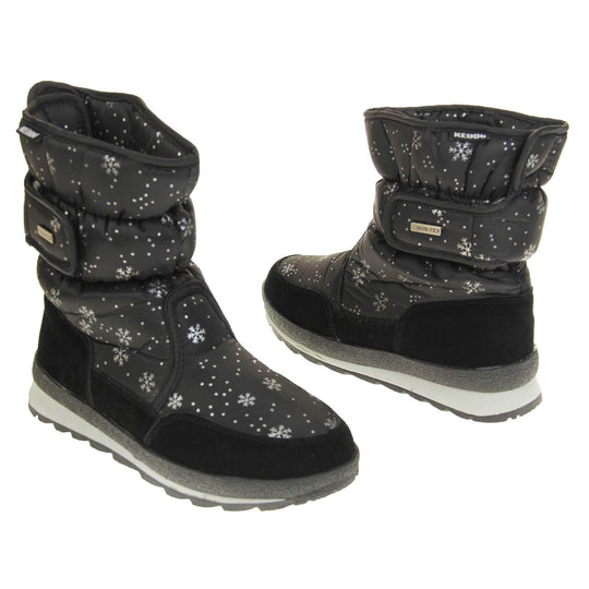 Womens Winter Boots. Black textile upper with snowflake and dots pattern on in white. Black faux-suede edging to the bottom of the boot . Grey and white chunky sole with good grip. Faux fur lining. Silver metal Win-Tex tag on the touch fasten strap, Keddo label along outside rim of the foot. Both feet facing top to tail.
