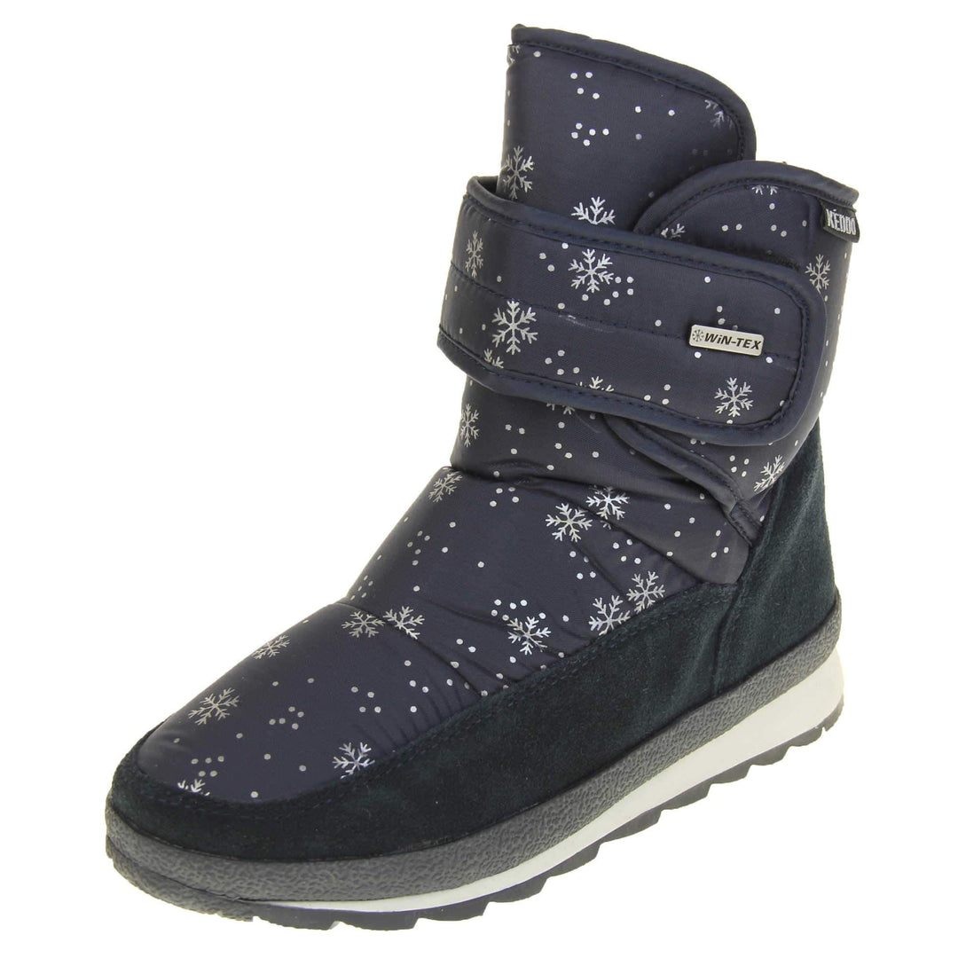 Womens Winter Boots. Navy blue textile upper with snowflake and dots pattern on in white. Dark blue faux-suede edging to the bottom of the boot . Grey and white chunky sole with good grip. Faux fur lining. Silver metal Win-Tex tag on the touch fasten strap, Keddo label along outside rim of the foot. Left foot at an angle.